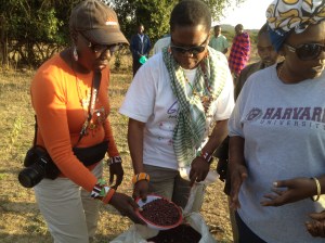 Pst. Ollie and Elder Helena in bush area of Mosiro Villagedistributing Beans 